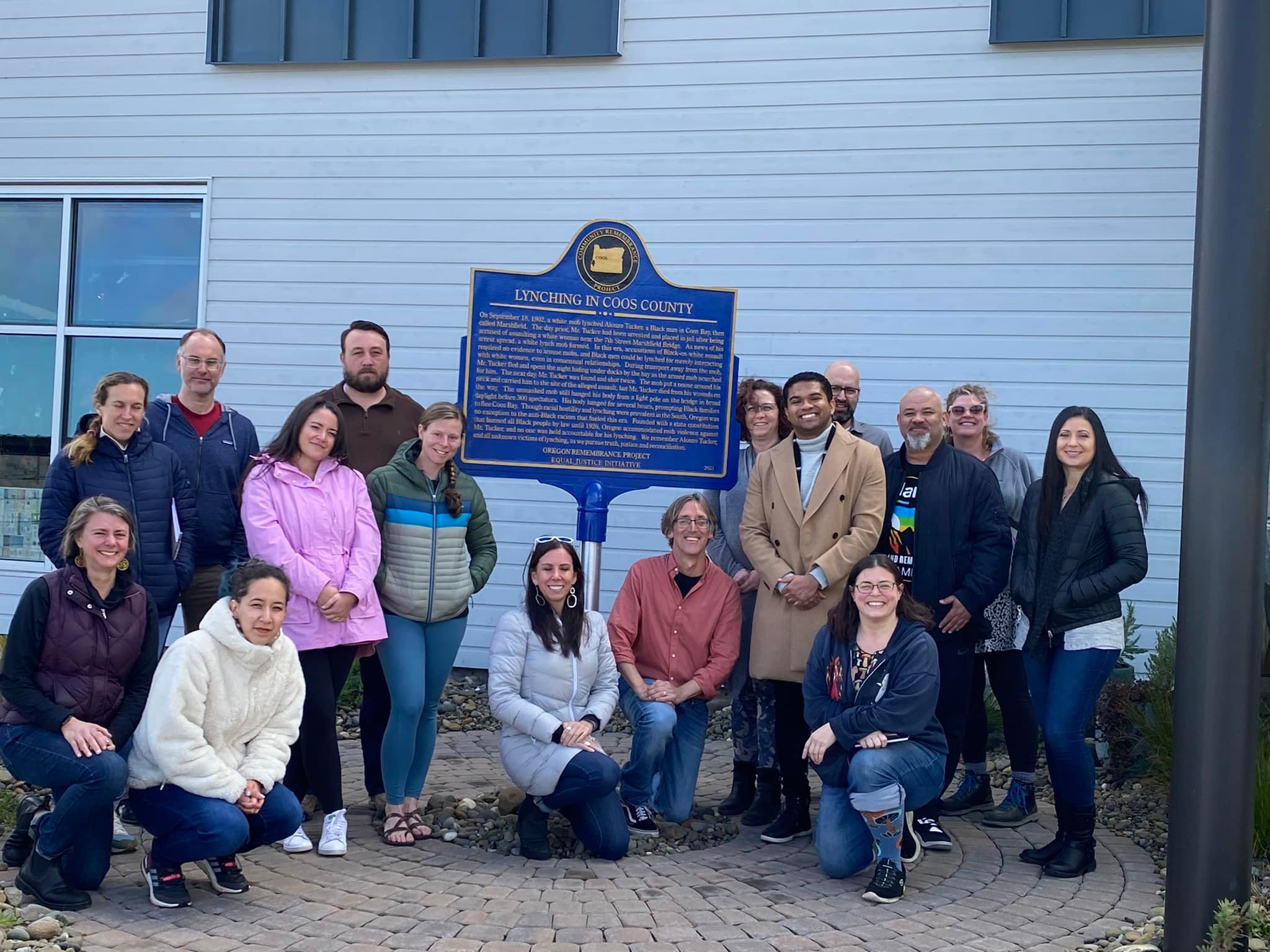 Coos Bay workshop participants posing outside of Coos Museum, where the memorial for Alonzo Tucker is located.
